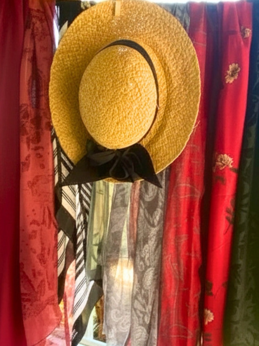 Eight scarves and a summer hat with bow